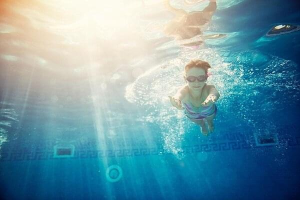 kid swimming in pool